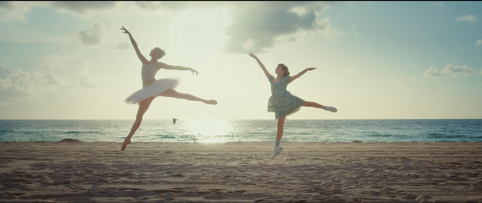 Ballet performers dancing on the beach